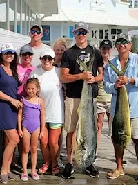 Hatteras charter group shows off their catch of big mahi.